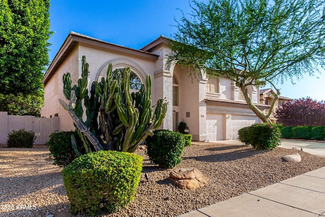 7247 W Buckskin Trl, Peoria, AZ 85383 - mediterranean / spanish home with stucco siding, a garage, and driveway