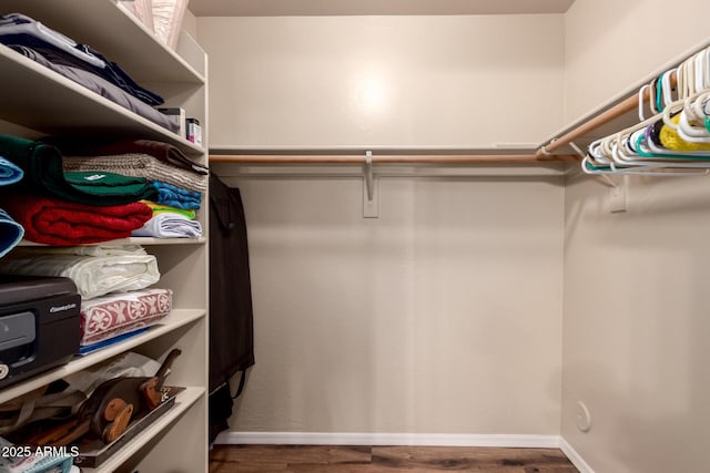 7247 W Buckskin Trl, Peoria, AZ 85383 - spacious closet featuring wood finished floors