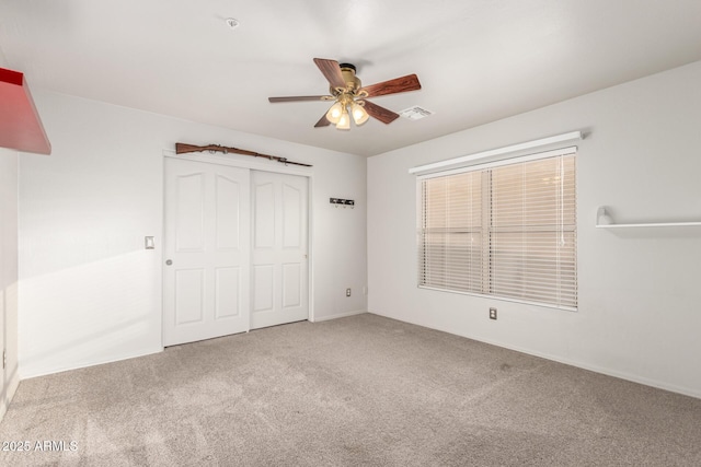 7247 W Buckskin Trl, Peoria, AZ 85383 - unfurnished bedroom featuring carpet, a closet, and a ceiling fan
