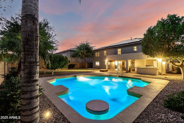 7247 W Buckskin Trl, Peoria, AZ 85383 - pool at dusk featuring a patio and a fenced backyard