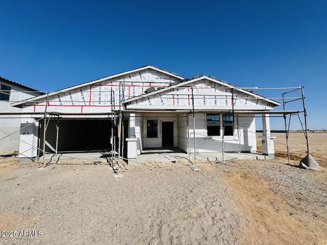 property in mid-construction with a garage