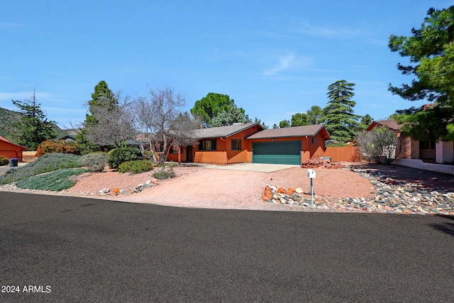 single story home featuring a garage