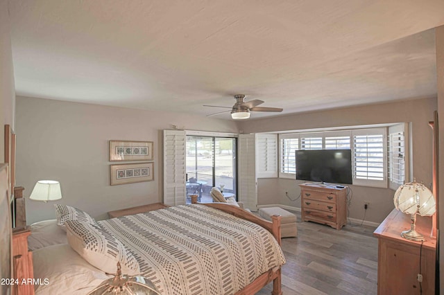 bedroom with access to outside, hardwood / wood-style flooring, and ceiling fan