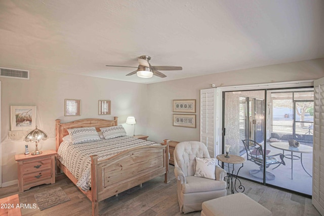 bedroom featuring ceiling fan, wood-type flooring, and access to outside