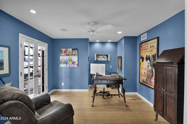 office space with ceiling fan, light hardwood / wood-style floors, and french doors