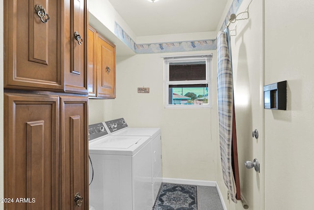 laundry area with cabinets and independent washer and dryer