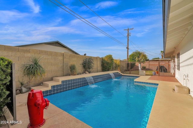 view of pool with pool water feature