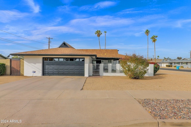 ranch-style home with a garage