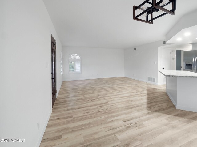 unfurnished living room featuring light wood-type flooring