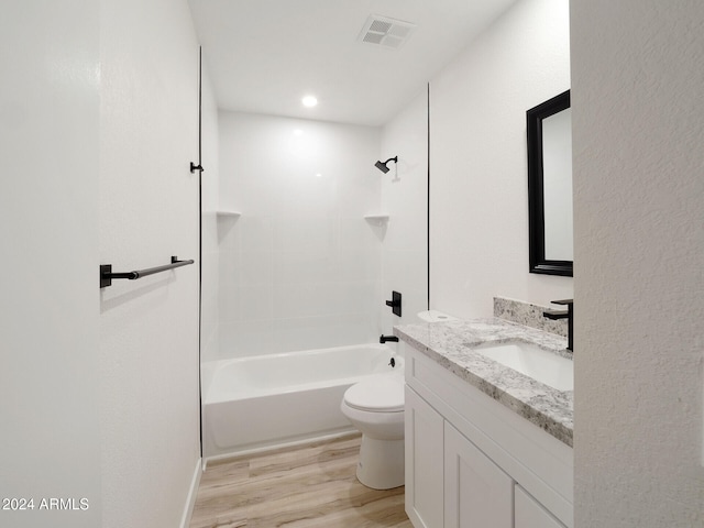 full bathroom featuring bathtub / shower combination, vanity, hardwood / wood-style flooring, and toilet