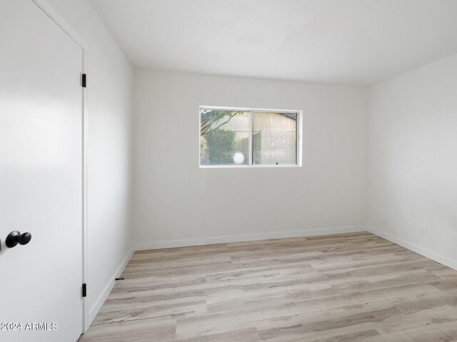 unfurnished room featuring light hardwood / wood-style floors