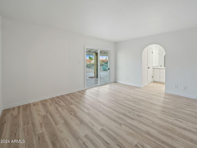 empty room with light wood-type flooring