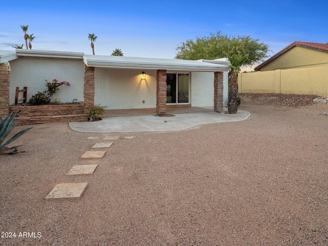 back of house featuring a patio