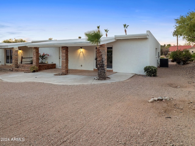 ranch-style home featuring central AC