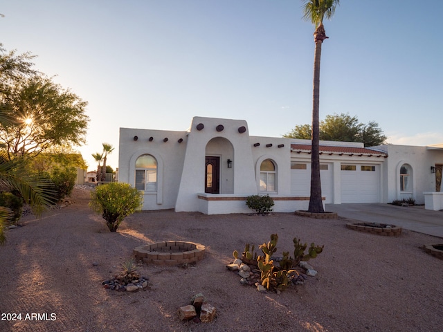 southwest-style home with a garage