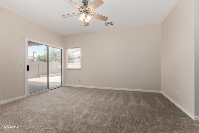 12238 W Monroe St, Avondale, AZ 85323 - carpeted empty room with a ceiling fan and baseboards