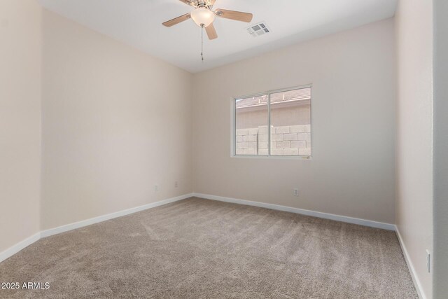 12238 W Monroe St, Avondale, AZ 85323 - spare room with carpet floors, ceiling fan, and baseboards