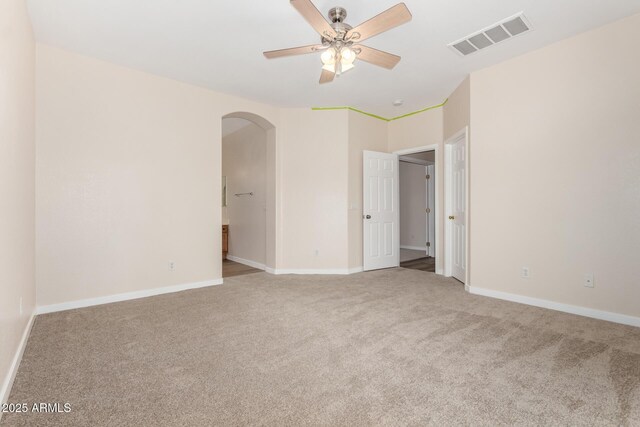 12238 W Monroe St, Avondale, AZ 85323 - unfurnished bedroom with arched walkways, carpet, and baseboards
