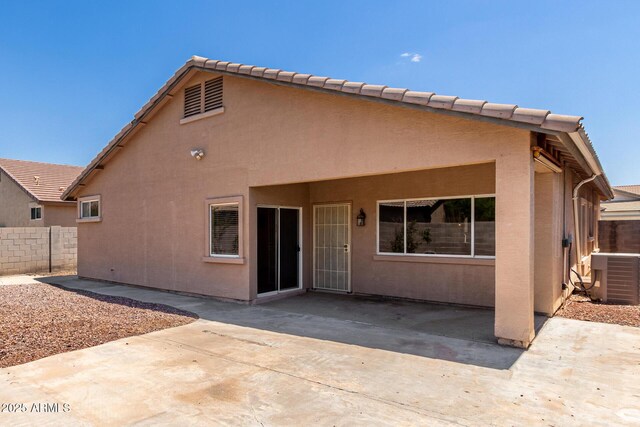 12238 W Monroe St, Avondale, AZ 85323 - rear view of house featuring a patio area, fence, central AC unit, and stucco siding