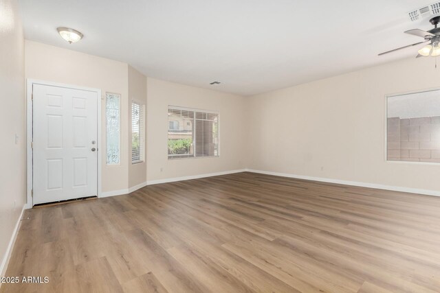 12238 W Monroe St, Avondale, AZ 85323 - entryway featuring light wood finished floors, a ceiling fan, and baseboards