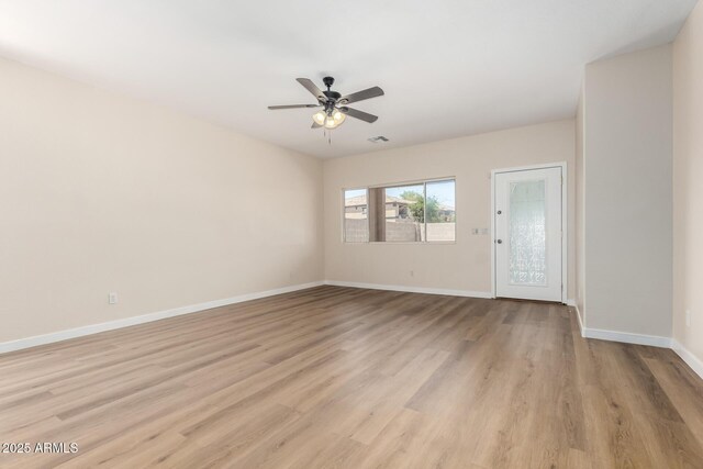 12238 W Monroe St, Avondale, AZ 85323 - unfurnished room featuring a ceiling fan, light wood-style flooring, and baseboards