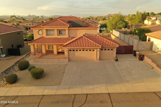 mediterranean / spanish house with a garage