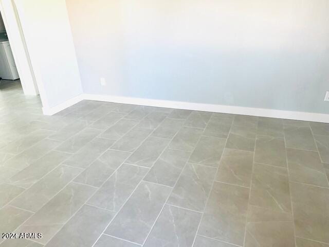 spare room with tile patterned flooring