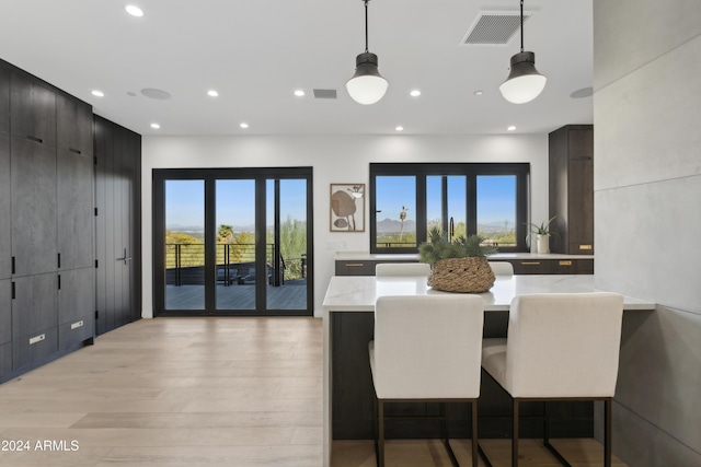 dining area with light hardwood / wood-style flooring