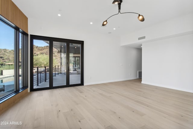 empty room with light wood-type flooring