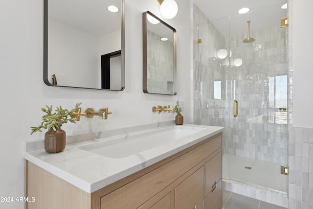 bathroom with sink, tile patterned floors, and an enclosed shower