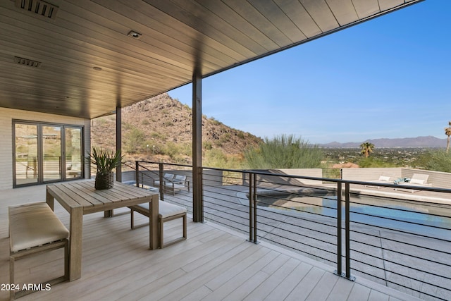 wooden terrace featuring a mountain view