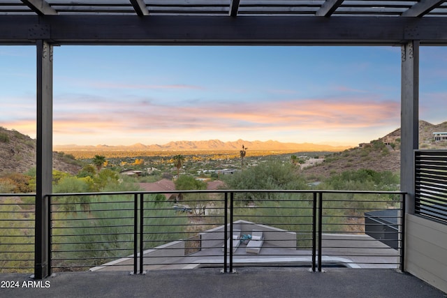 balcony at dusk with a mountain view