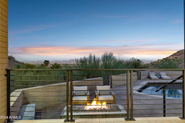 deck at dusk with a mountain view