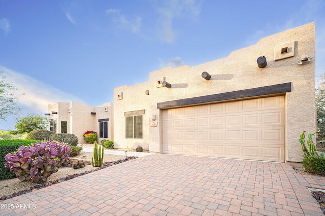 5520 E Desert Forest Trl, Cave Creek, AZ 85331 - pueblo-style house with decorative driveway and stucco siding