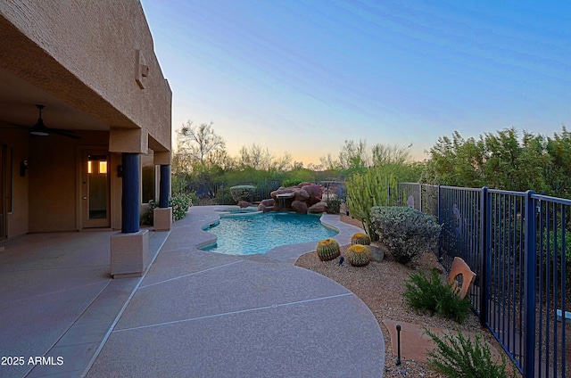 5520 E Desert Forest Trl, Cave Creek, AZ 85331 - pool at dusk with ceiling fan and a patio area