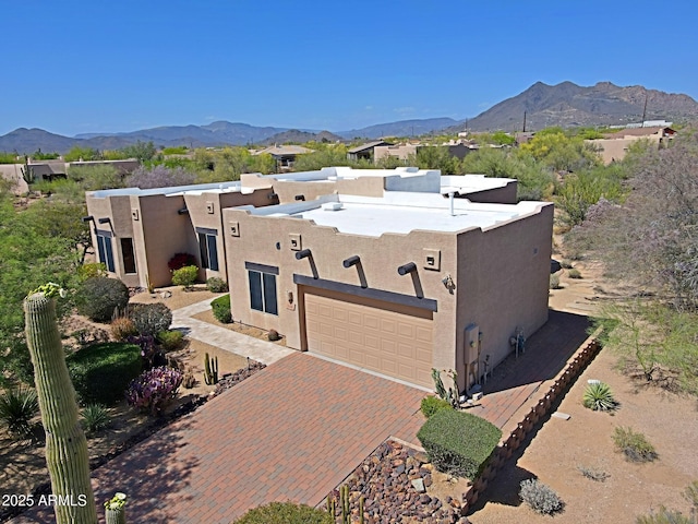 5520 E Desert Forest Trl, Cave Creek, AZ 85331 - southwest-style home with a mountain view, stucco siding, a garage, and decorative driveway