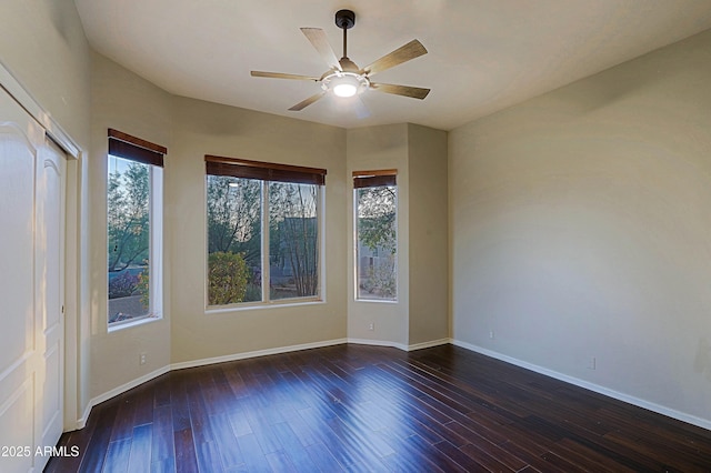 5520 E Desert Forest Trl, Cave Creek, AZ 85331 - spare room with a ceiling fan, baseboards, and dark wood-type flooring