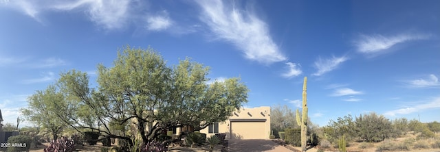 5520 E Desert Forest Trl, Cave Creek, AZ 85331 - view of front of home with stucco siding, driveway, and a garage