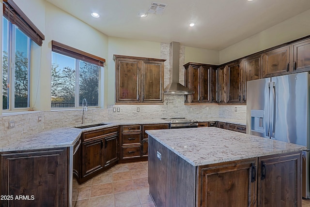 5520 E Desert Forest Trl, Cave Creek, AZ 85331 - kitchen featuring a sink, stainless steel appliances, wall chimney exhaust hood, light stone countertops, and backsplash