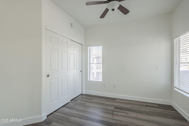 600 W Grove Pkwy Unit 2188, Tempe, AZ 85283 - unfurnished bedroom with multiple windows, dark wood-type flooring, and a closet