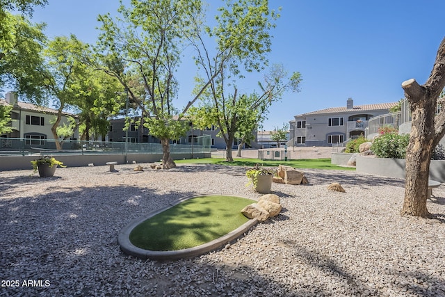 600 W Grove Pkwy Unit 2188, Tempe, AZ 85283 - view of community featuring a putting green and a residential view
