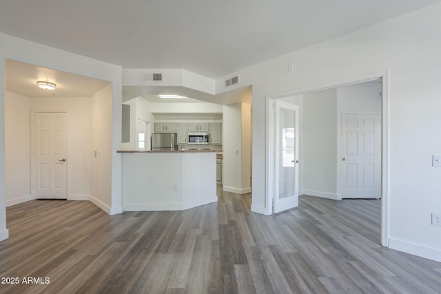 600 W Grove Pkwy Unit 2188, Tempe, AZ 85283 - unfurnished living room with dark wood-style flooring