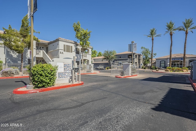 600 W Grove Pkwy Unit 2188, Tempe, AZ 85283 - view of asphalt street with a gated entry and curbs