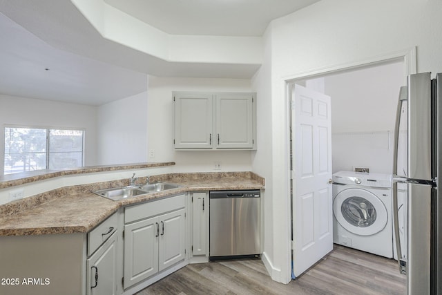 600 W Grove Pkwy Unit 2188, Tempe, AZ 85283 - washroom with washer / dryer and light wood-style flooring
