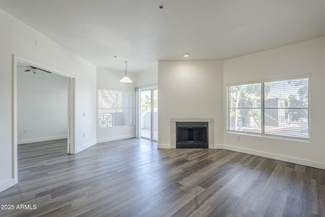 600 W Grove Pkwy Unit 2188, Tempe, AZ 85283 - unfurnished living room featuring dark wood-style flooring and a tiled fireplace
