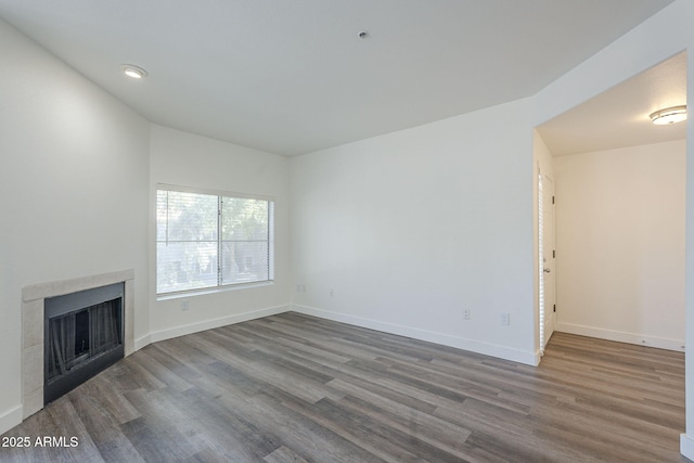 600 W Grove Pkwy Unit 2188, Tempe, AZ 85283 - unfurnished living room with wood finished floors and a fireplace