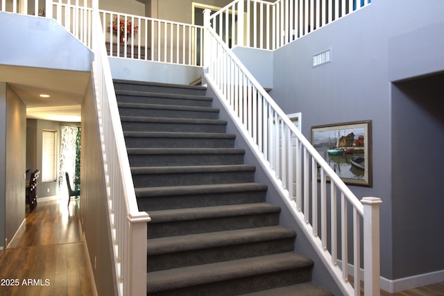 8920 S 40th Ln, Laveen, AZ 85339 - staircase with wood finished floors and baseboards
