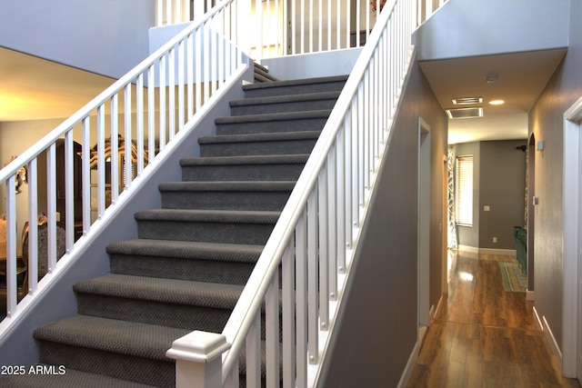 8920 S 40th Ln, Laveen, AZ 85339 - stairway featuring wood finished floors, baseboards, and recessed lighting