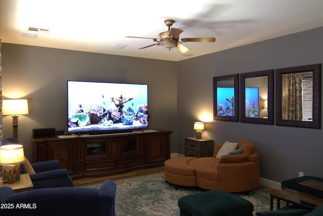 8920 S 40th Ln, Laveen, AZ 85339 - living area featuring wood finished floors, ceiling fan, and baseboards
