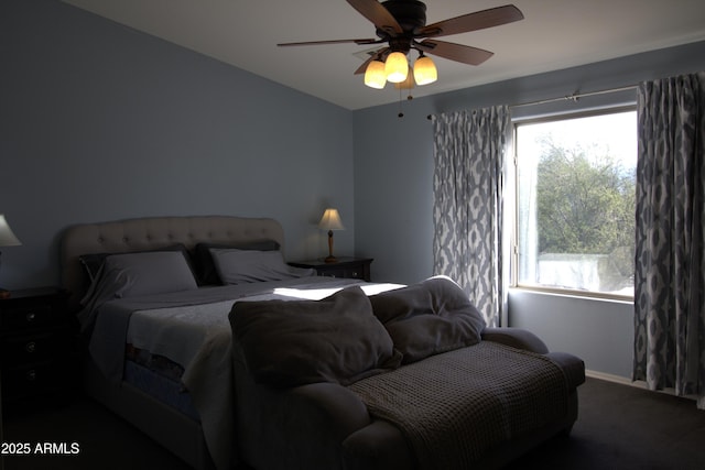 8920 S 40th Ln, Laveen, AZ 85339 - carpeted bedroom featuring multiple windows, a ceiling fan, and baseboards